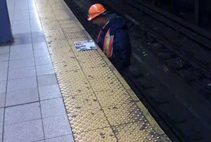 Photo of MTA worker reading a magazine from JR from Brooklyn's flickr